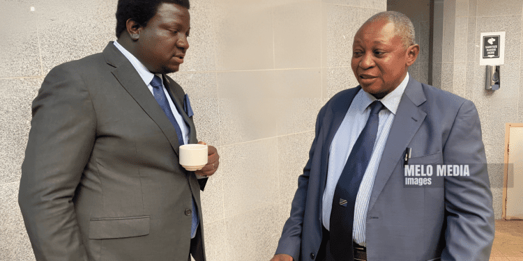 Nalolo MP Hon. Imanga Wamunyima Confers with Former Bank of Zambia Governor Dr. Caleb Fundanga During PAC Session